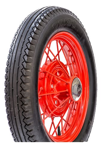 A red tire with black spokes on a white background, featuring the 440 by 450 21 LUCAS Olympic Tread Blackwall.