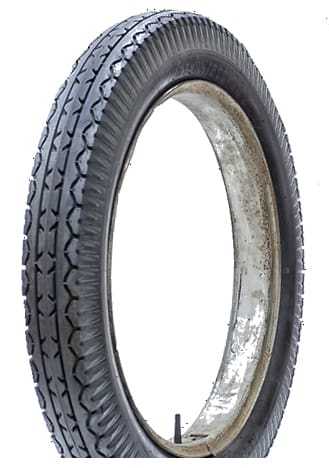 A 33x4 1 by 2 500 24 LUCAS Old Dunlop Tread Blackwall motorcycle tire on a white background.