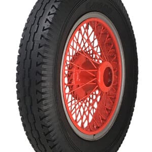A black and orange 650-19 LUCAS Blackwall tire on a white background, characterized by its design.